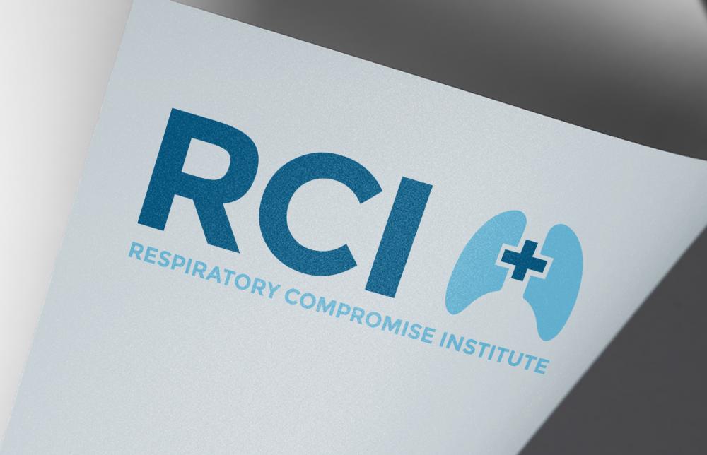 Respiratory Compromise Institute logo, Read RCI with lungs overlaid with a plus