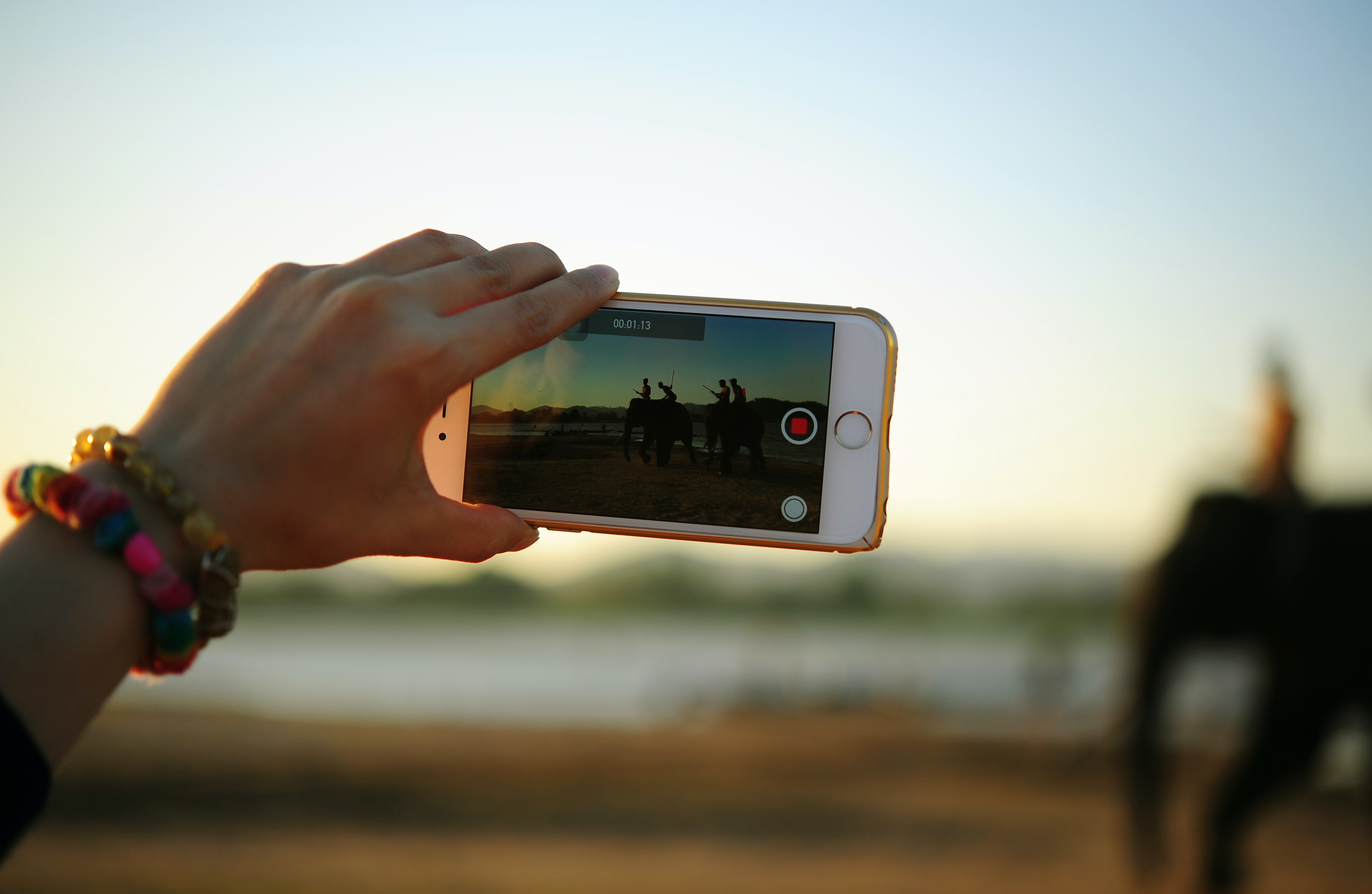 Person uses smart phone to capture video
