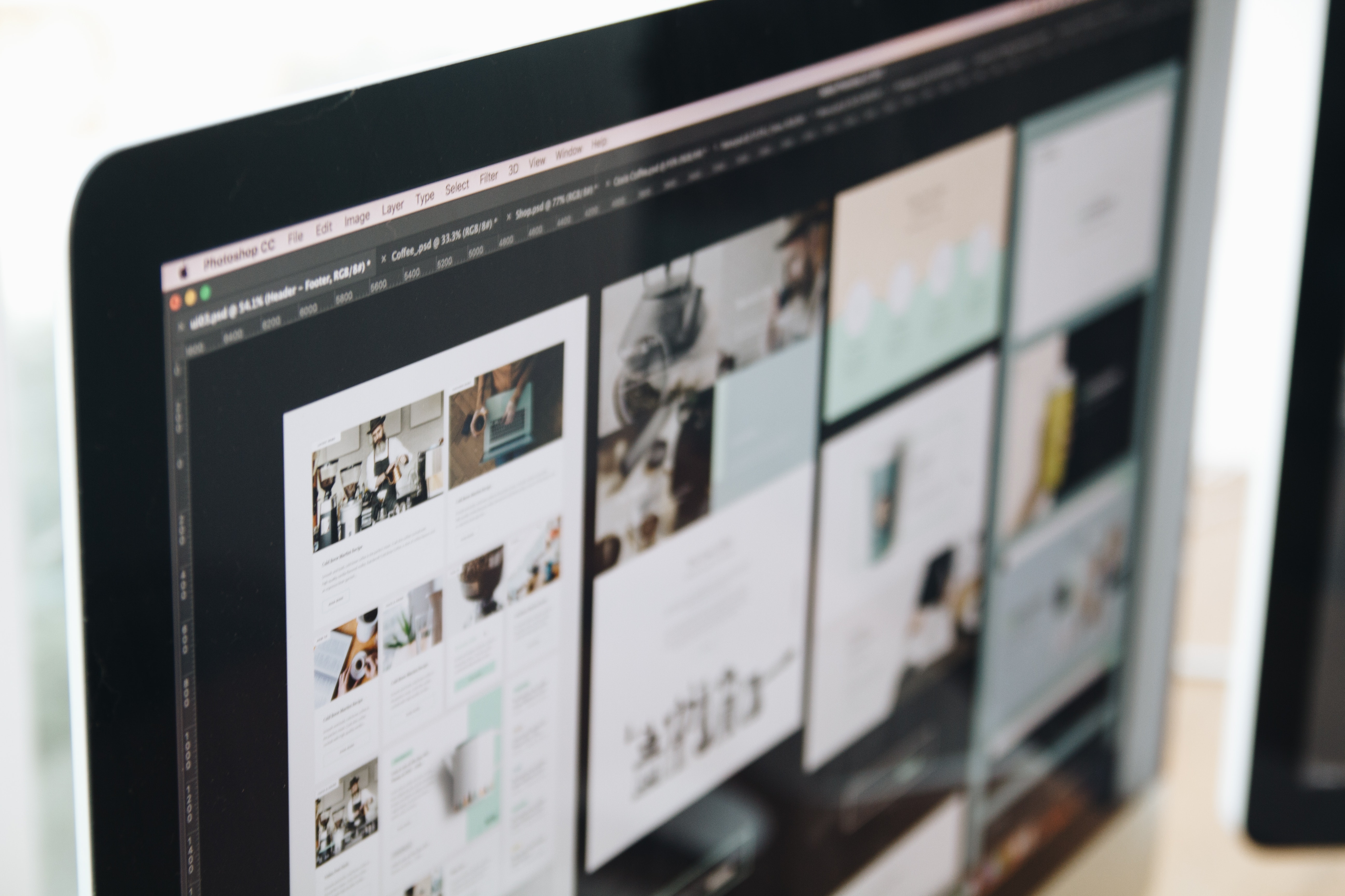 Close up view of a design software being used to design a brand concept on a desktop computer