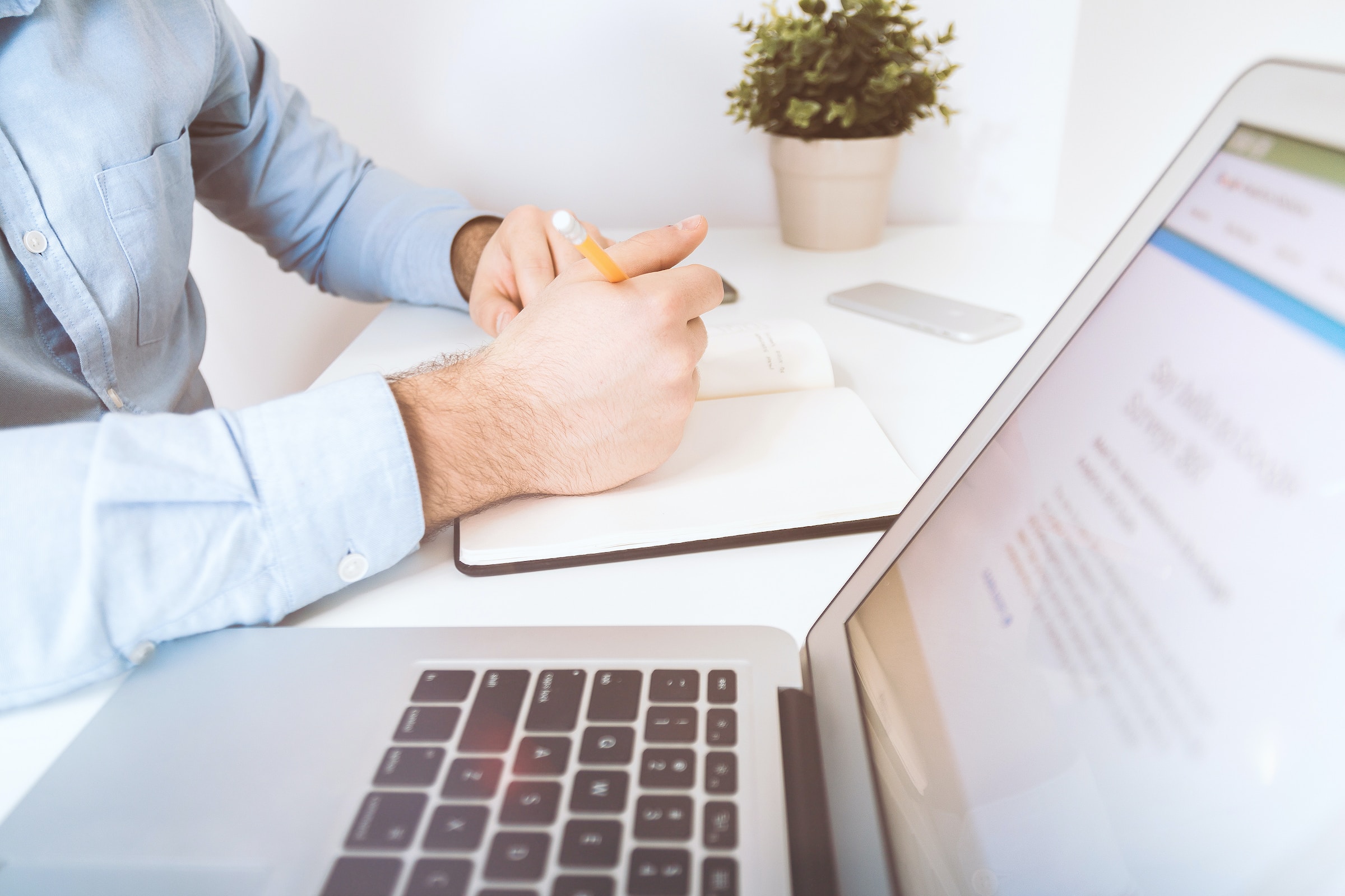 Conversion rate optimization person next to laptop