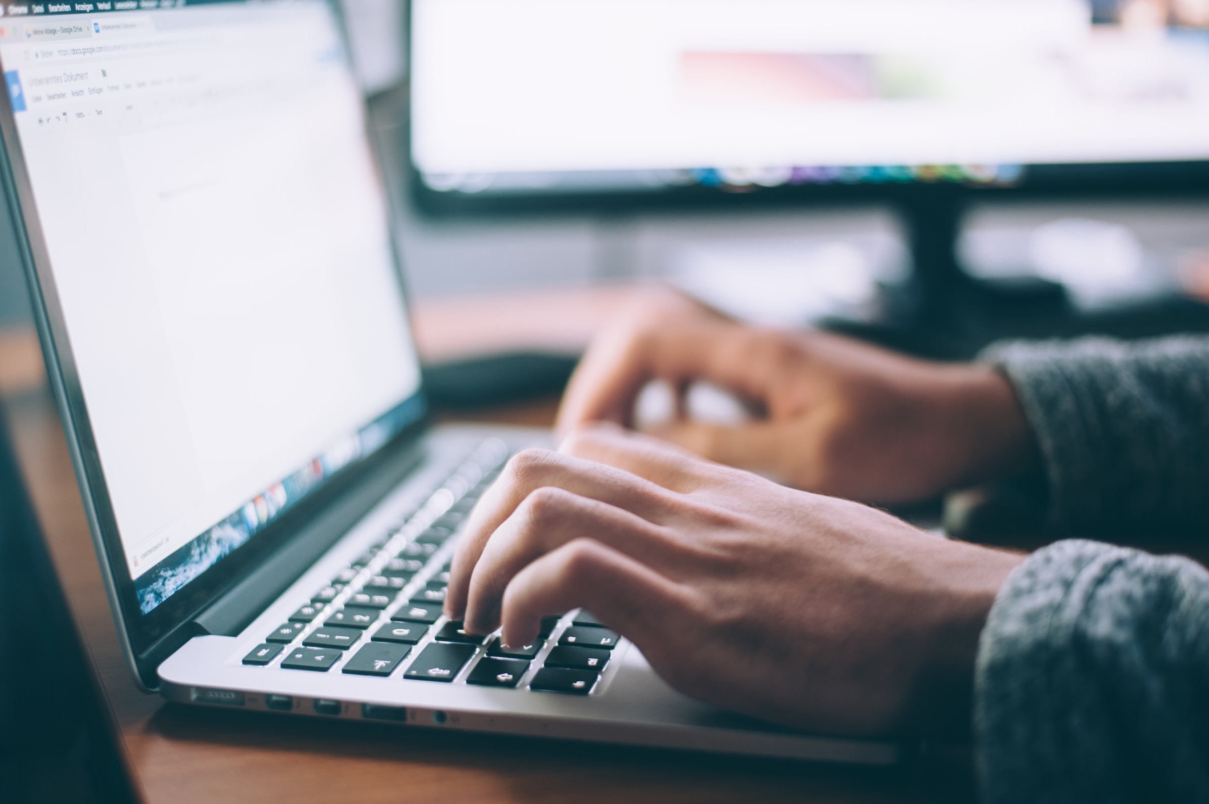 Conversion rate optimization person writing on laptop