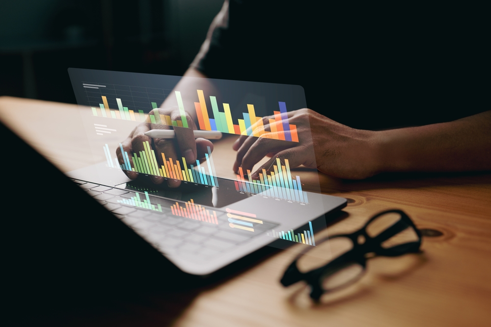 hands typing on keyword to review the website development costs