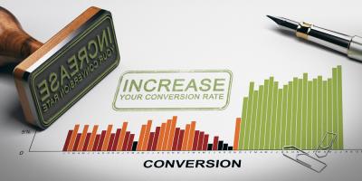 Highest Converting Websites with a Marketing Agency Bar Graph with an Ink Stamp reading "increase your conversions" on a piece of paper