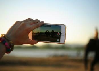 Person uses smart phone to capture video