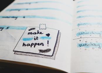 Bullet journal to do list with an illustration of a taped note saying "Make It Happen!"