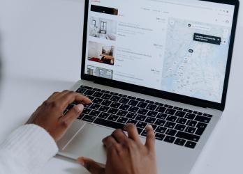 Person browses local map on laptop