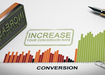 Highest Converting Websites with a Marketing Agency Bar Graph with an Ink Stamp reading "increase your conversions" on a piece of paper