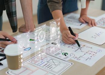 Close up ux developer and ui designer brainstorming interface wireframe design. Creative web design and digital development agency