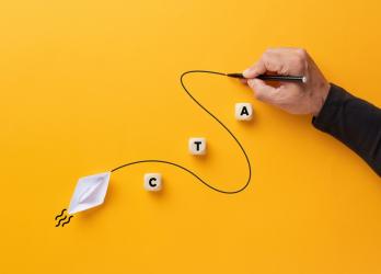 Male hand draws a curved line that guides a paper boat with the abbreviation CTA
