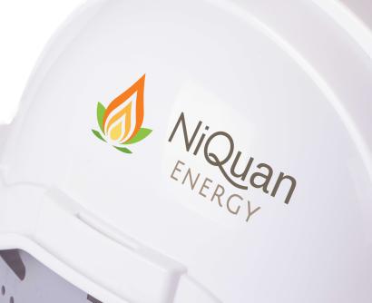 Hard hat with NiQuan Energy's logo on the side