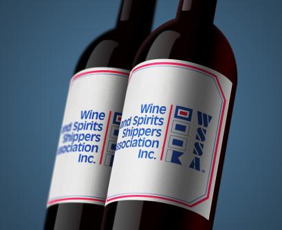 Two wine bottles with babes reading "Wine & Spirit Shippers Association"